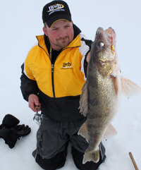 image of Jonny Petrowske holding Walleye on ice